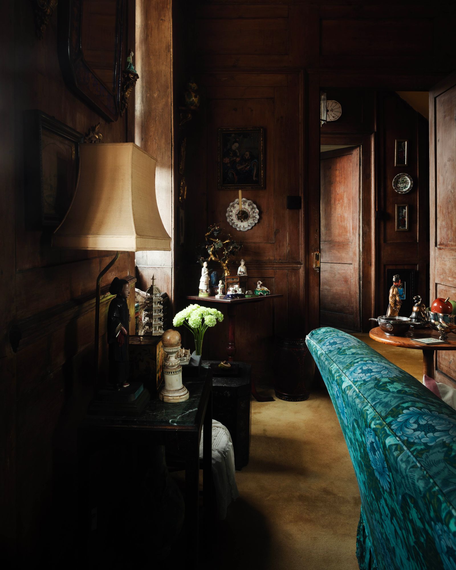 William Morris textiles designed in the 1870s provide a colourful contrast to the early 18thcentury walls