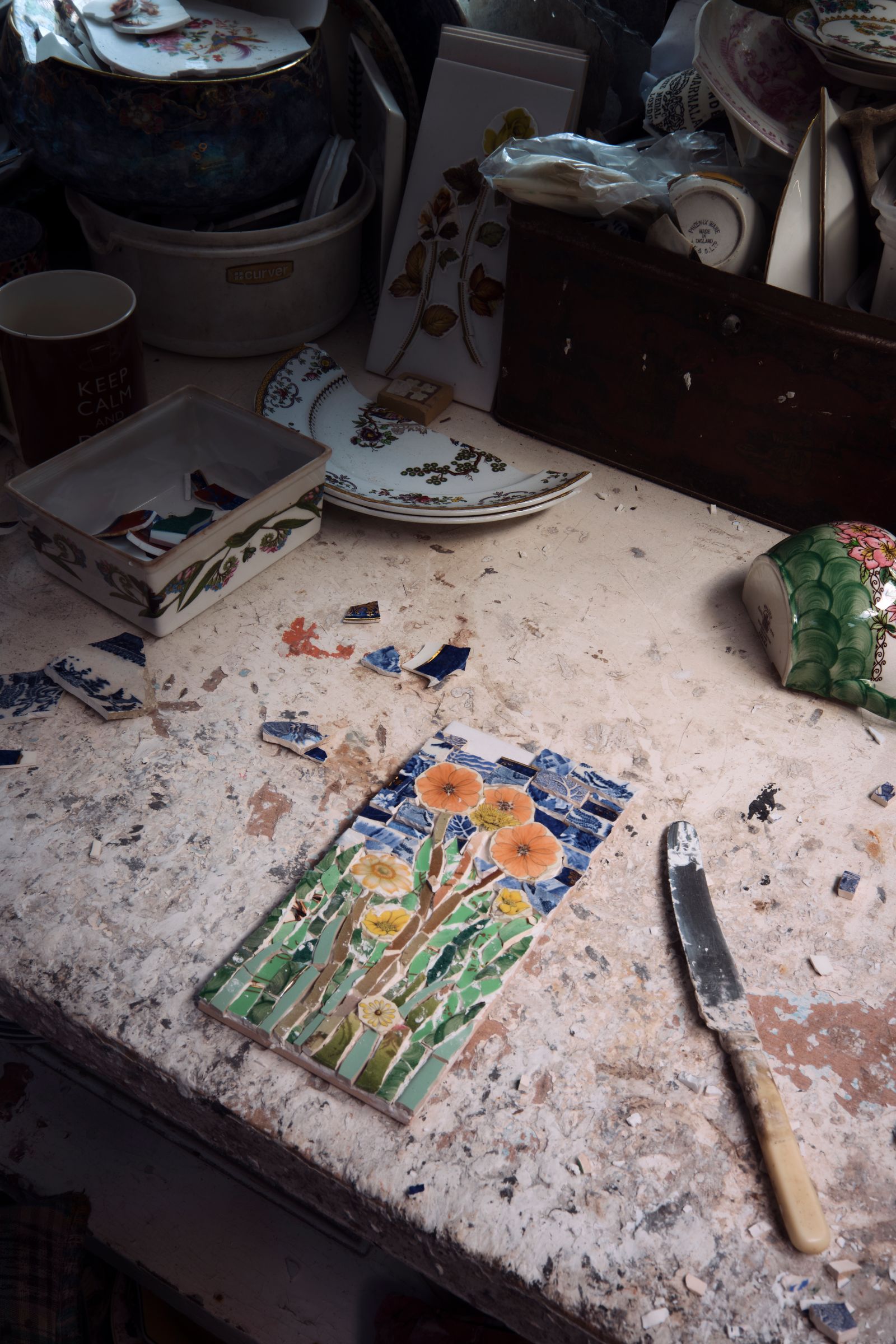Image may contain Cutlery Pottery Furniture Table Box Art Porcelain Blade Knife Weapon Cup Tabletop and Plate