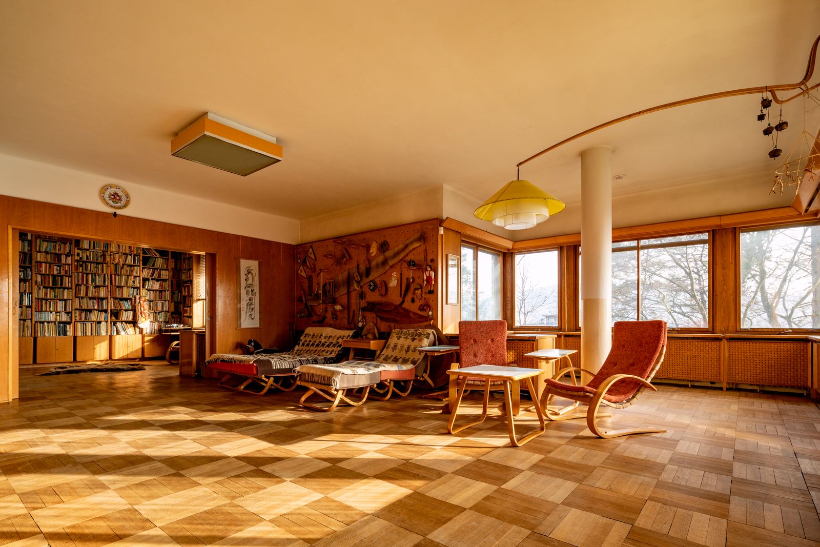 Chequerboard parquet covers the floor of the openplan living space