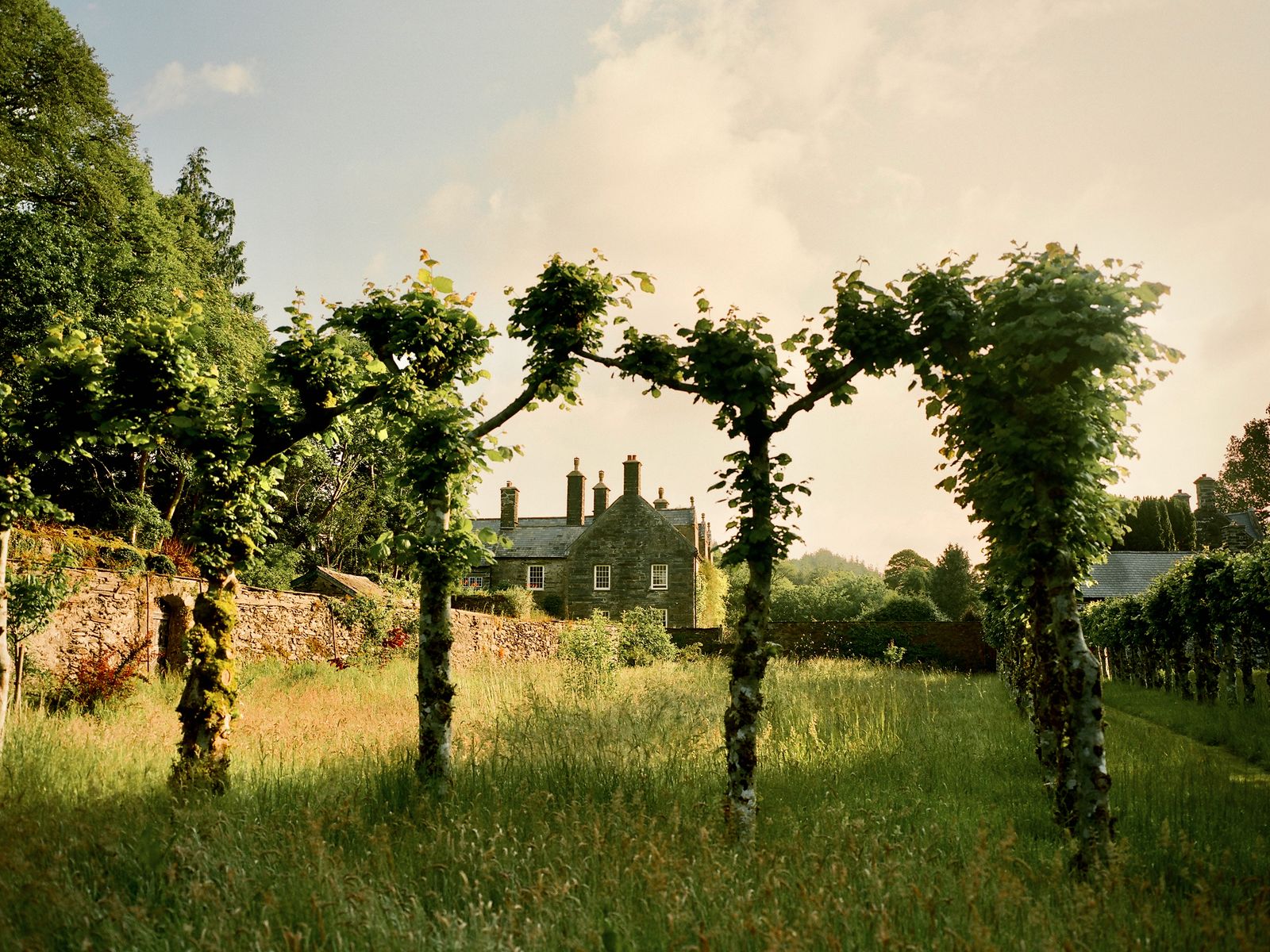 Tallulah and Amanda Harlech traverse the grounds of Glyn Cywarch