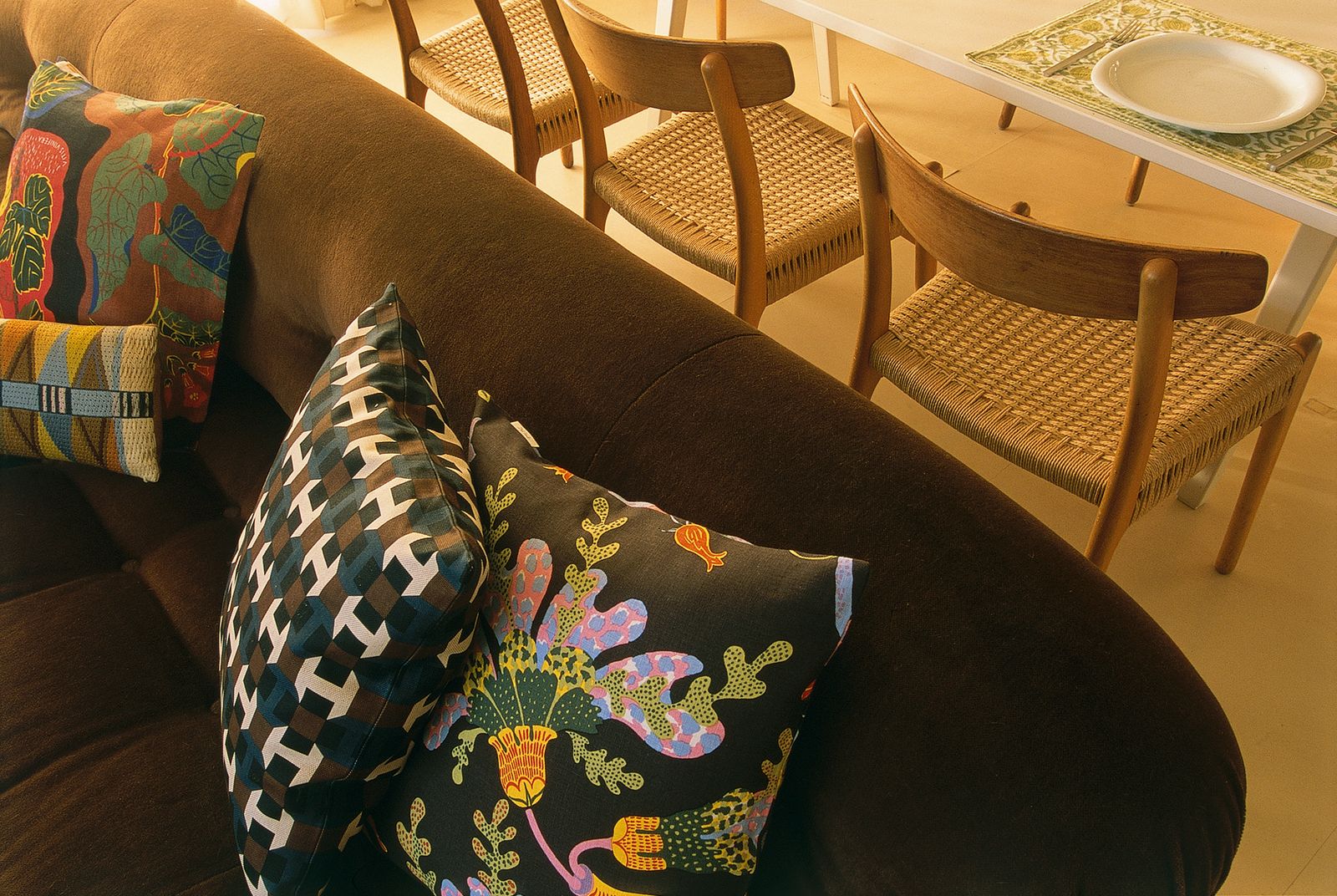 Image may contain Couch Cushion Furniture Home Decor Pillow Chair Plate Table Architecture Building and Indoors