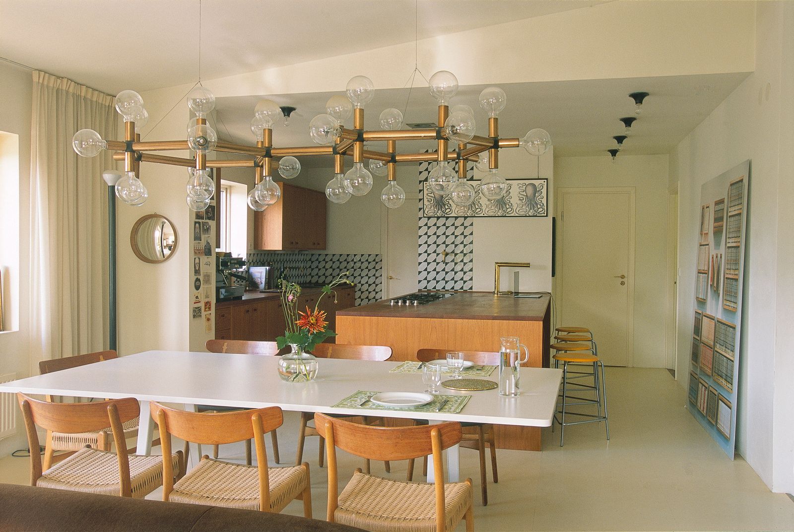 Image may contain Architecture Building Dining Room Dining Table Furniture Indoors Room Table Chandelier and Lamp
