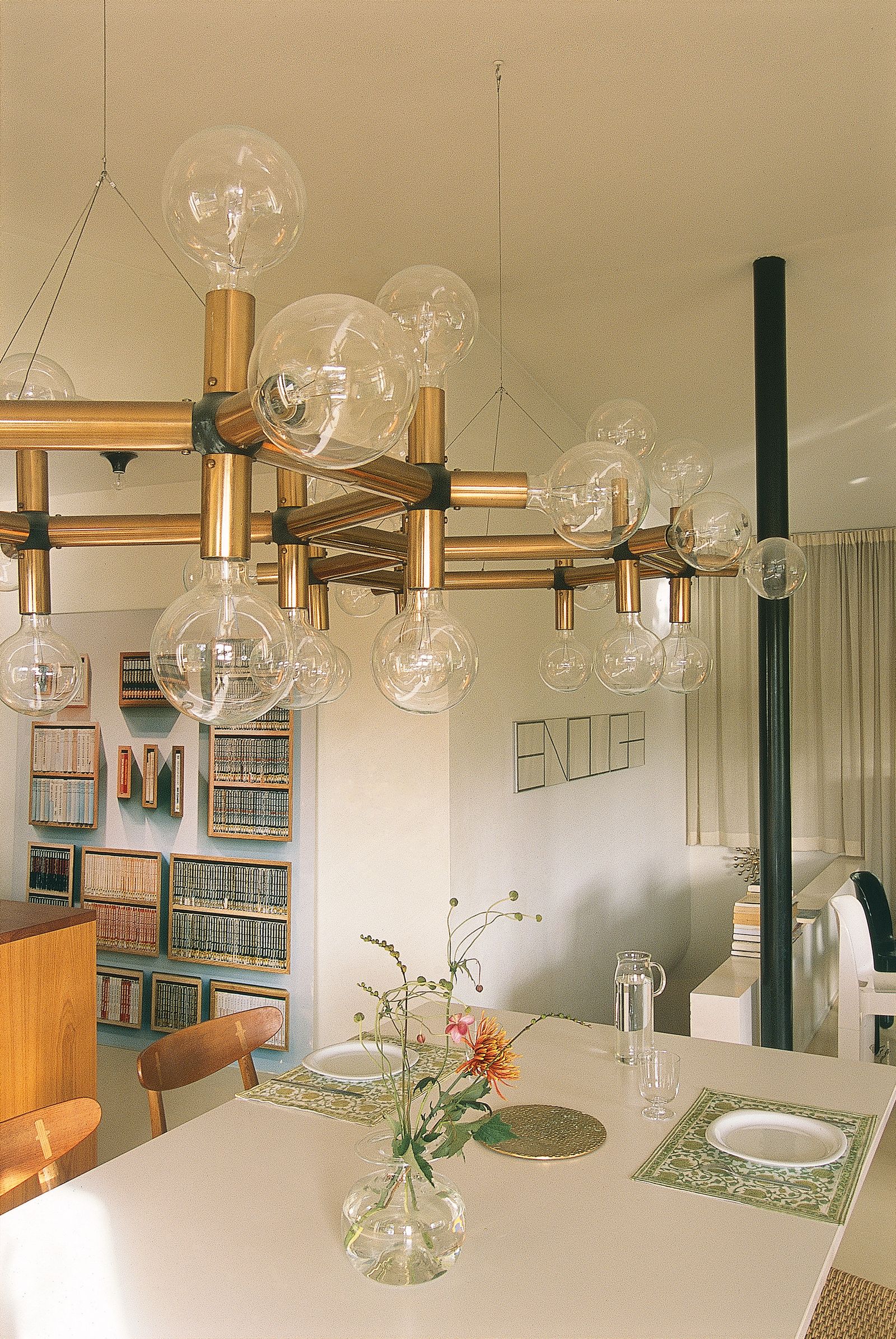 Image may contain Architecture Building Dining Room Dining Table Furniture Indoors Room Table Chandelier and Lamp
