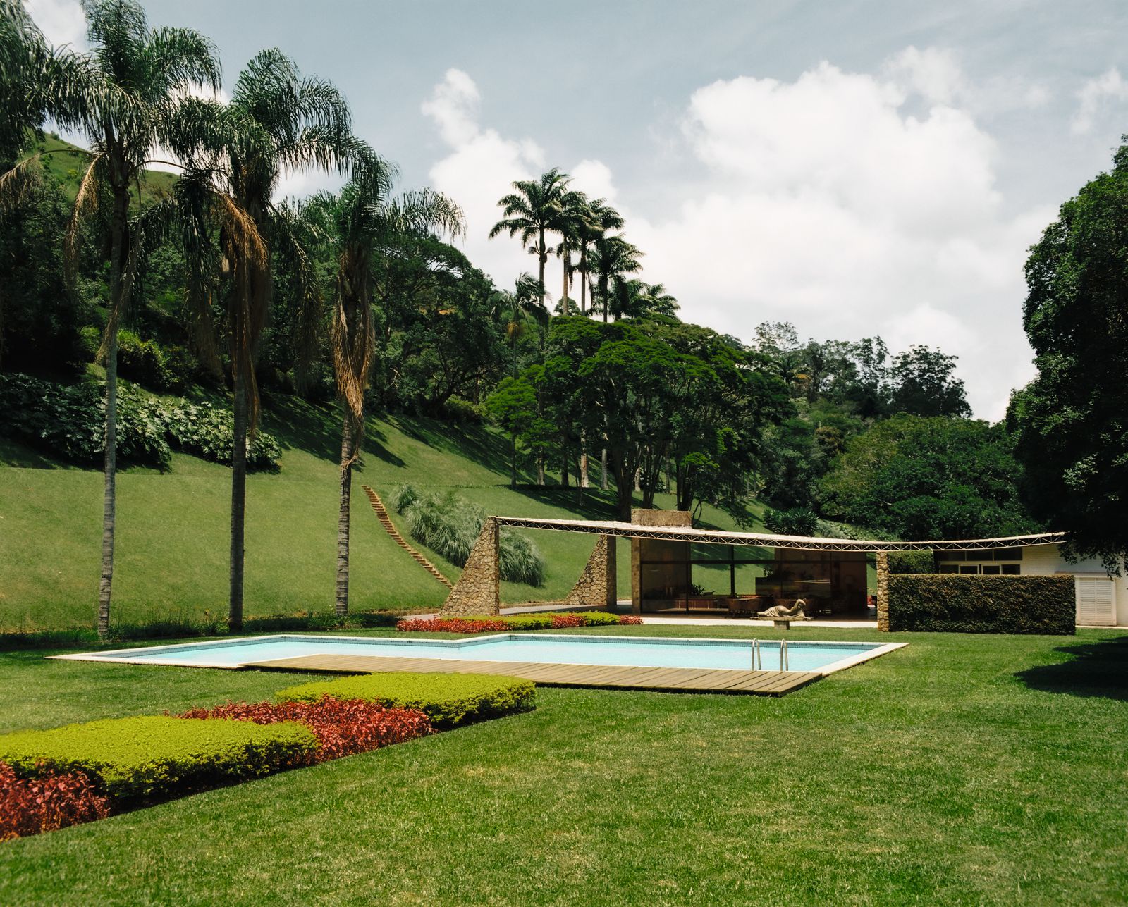 Image may contain Grass Plant Architecture Building Hotel Resort House Housing Villa Nature Outdoors and Park