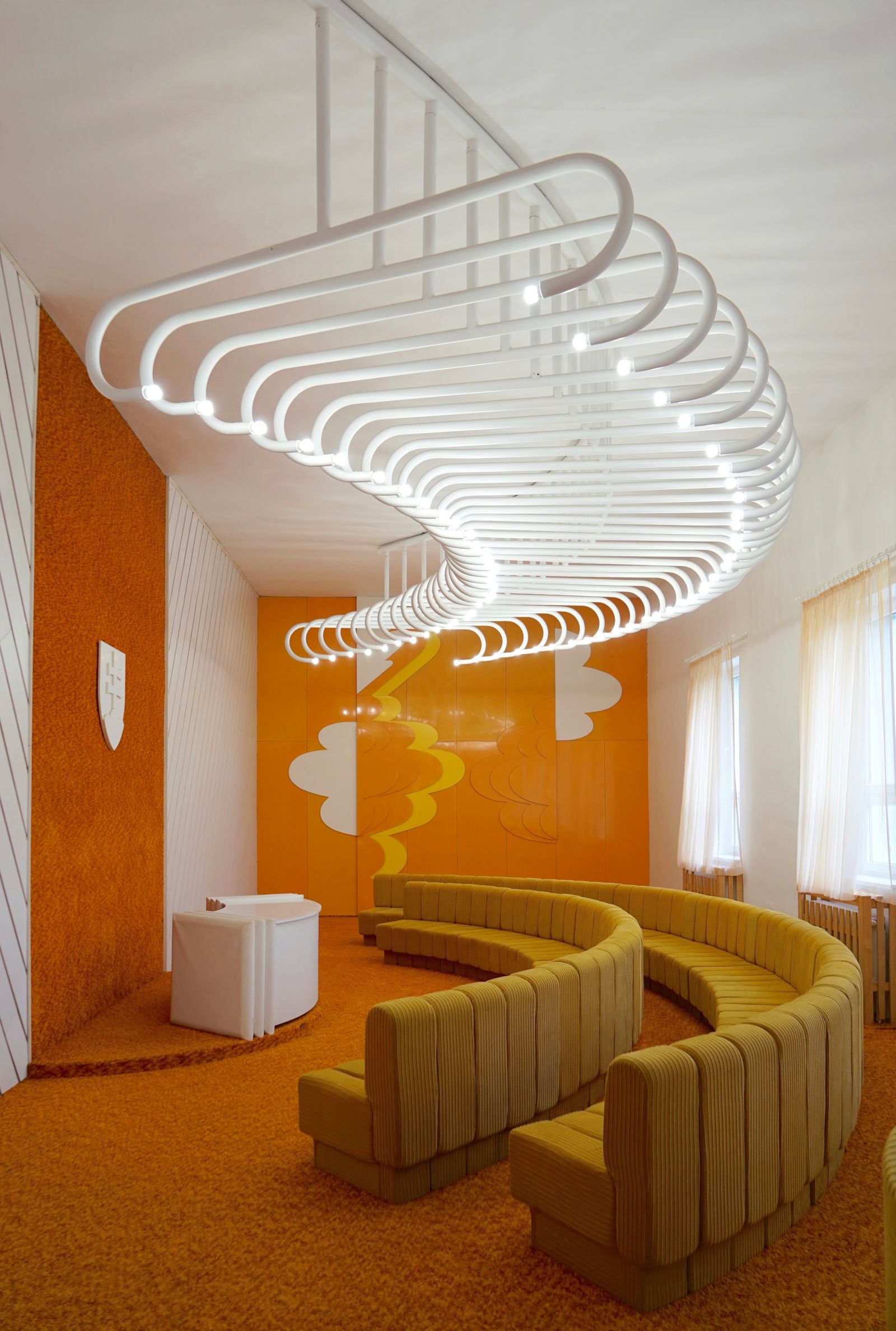 Image may contain Indoors Architecture Building Foyer Furniture Living Room Room Couch House Housing and Staircase