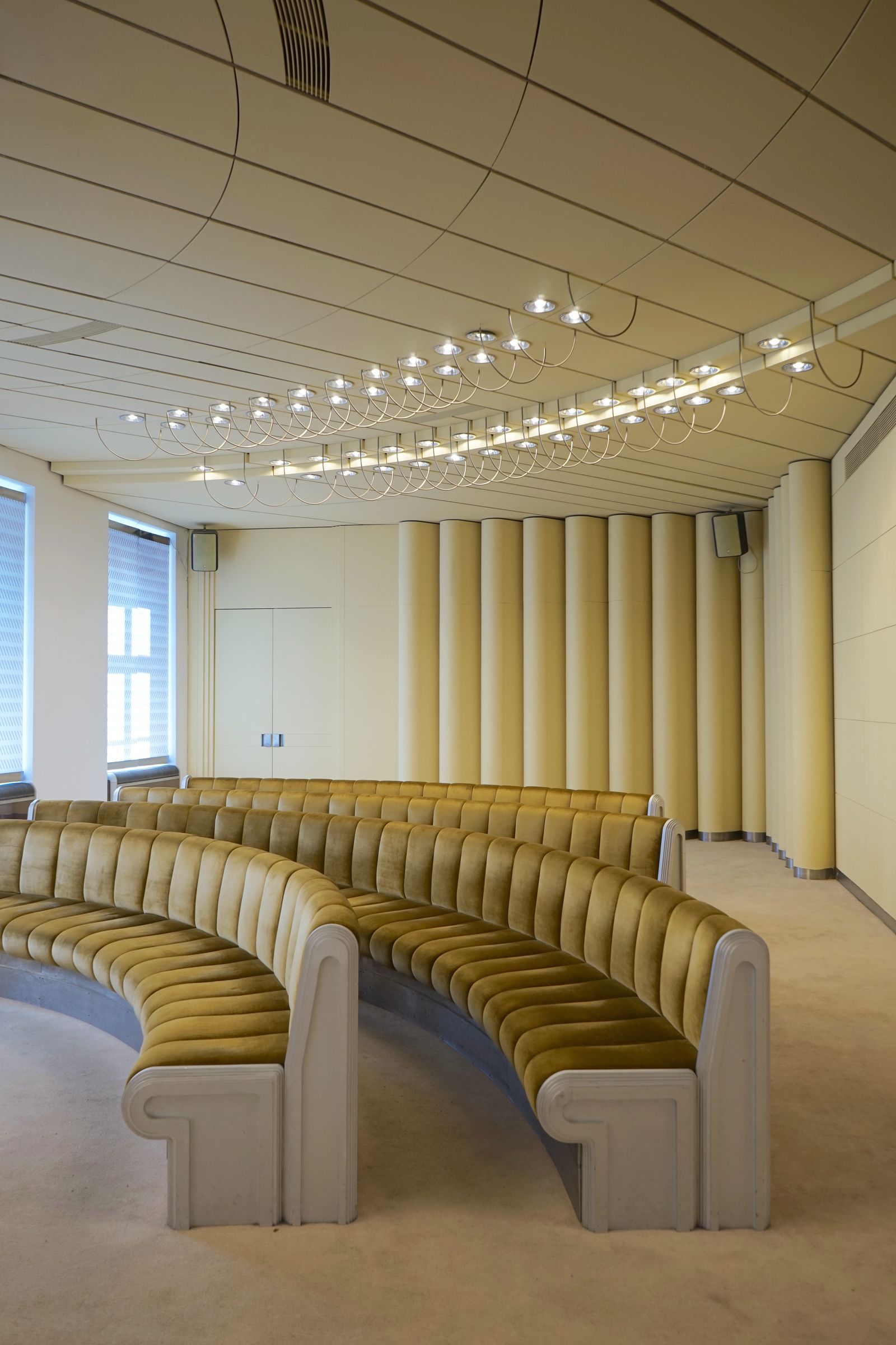 Image may contain People Person Indoors Architecture Building Classroom Room School Crowd Audience and Lecture