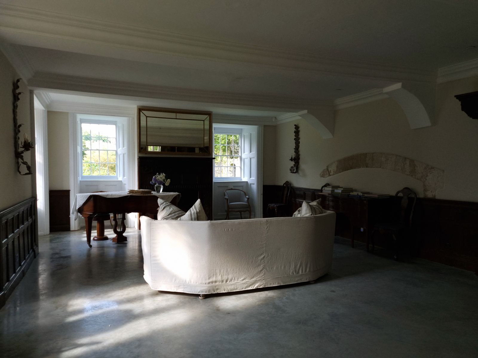 Image may contain Architecture Building Furniture Indoors Living Room Room Chair Couch Interior Design and Floor