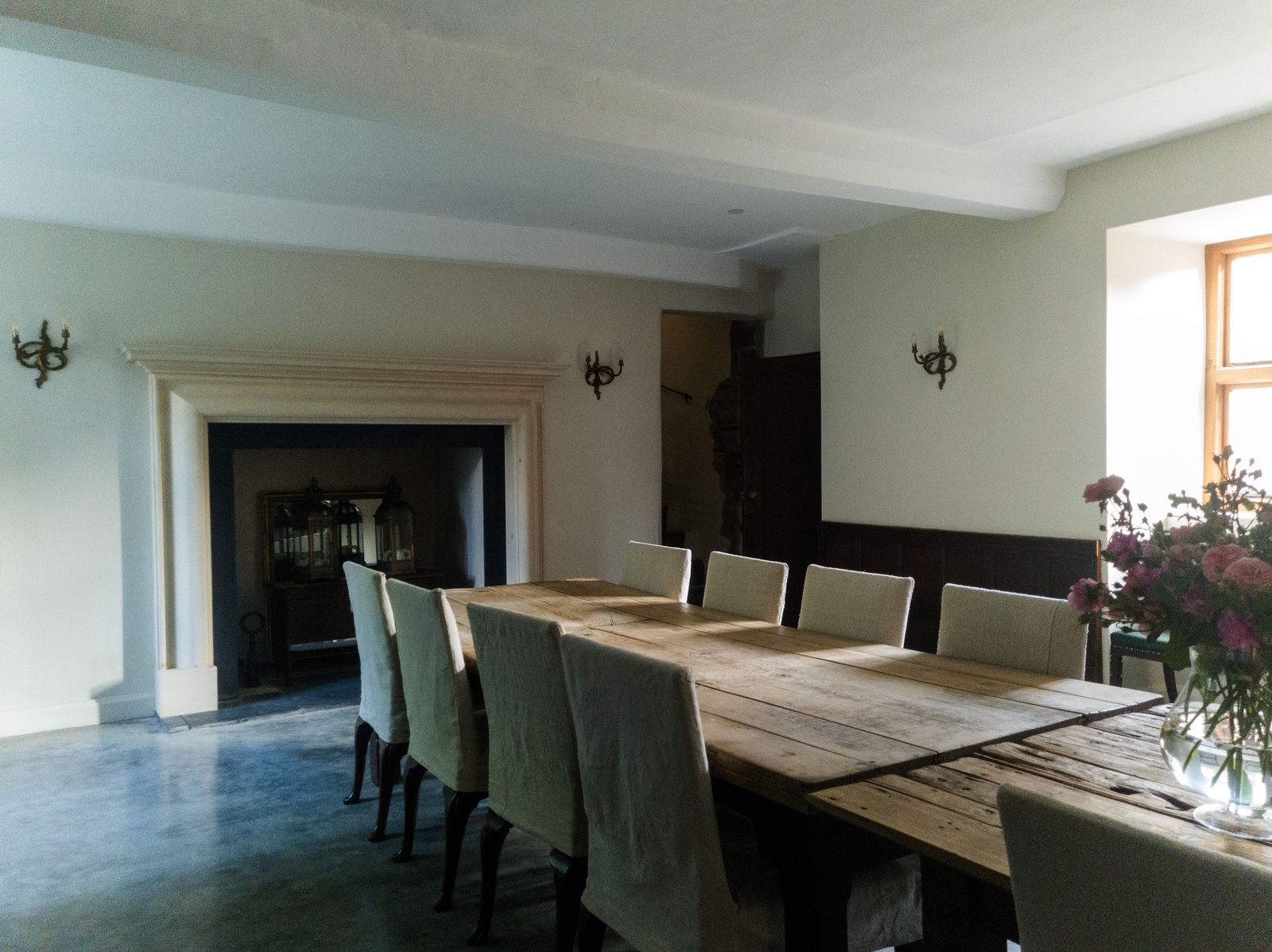 Image may contain Architecture Building Dining Room Dining Table Furniture Indoors Room Table Lamp and Tabletop