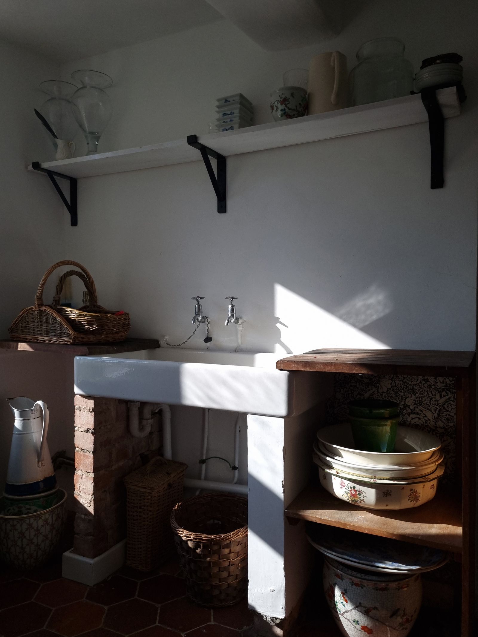 Image may contain Shelf Sink Sink Faucet and Cup