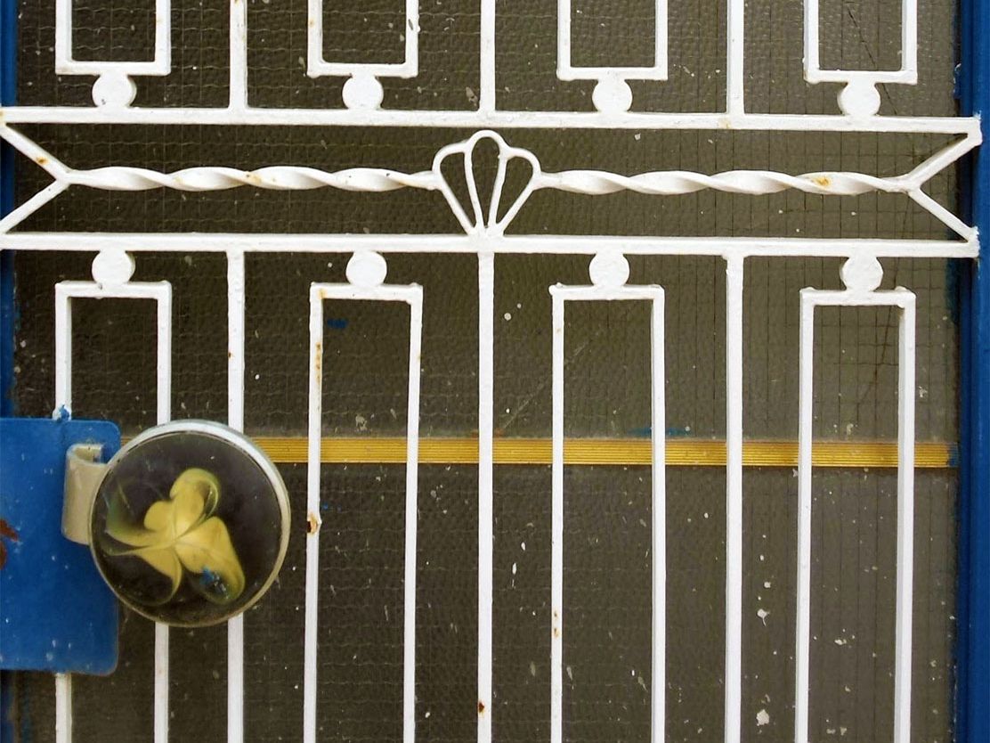 Not any old iron: the everyday charm of ornate metal grills on Greek doors