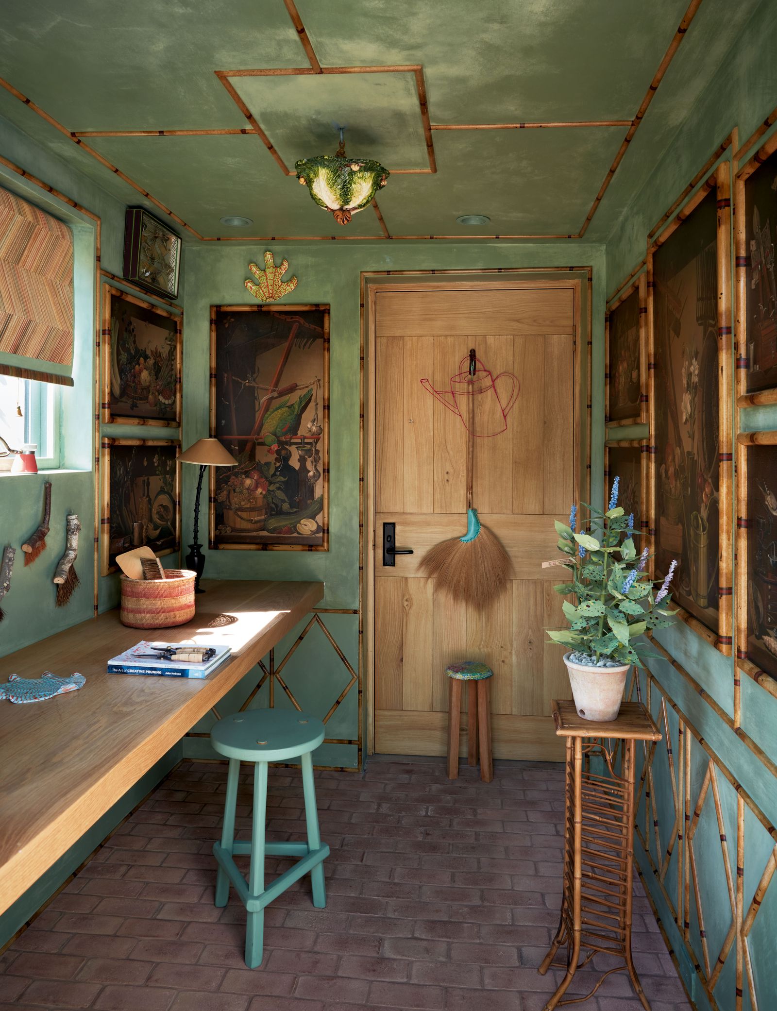 Image may contain Indoors Interior Design Book Publication Plant Lamp Desk Furniture Table Floor Wood and Art