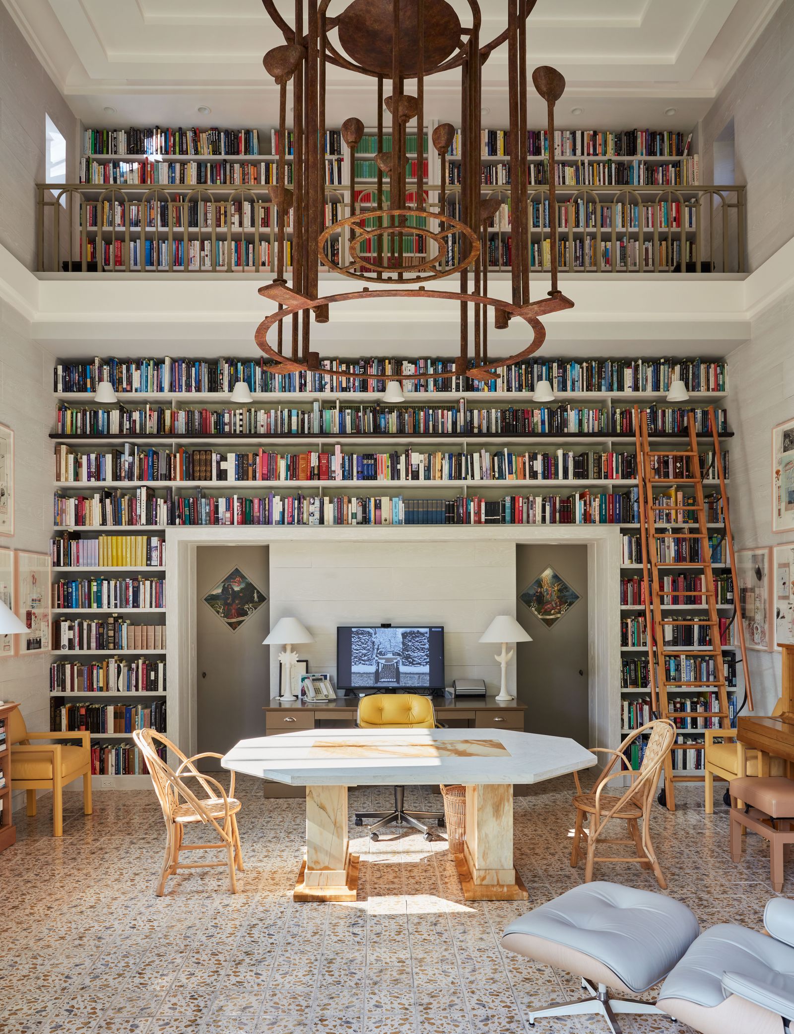 Image may contain Furniture Lamp Chair Desk Table Bookcase Computer Hardware Electronics Hardware and Monitor