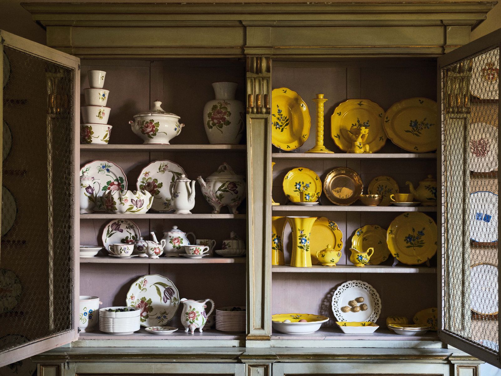 Image may contain Cabinet Furniture Closet Cupboard Helmet Art Porcelain Pottery China Cabinet Cup and Plate