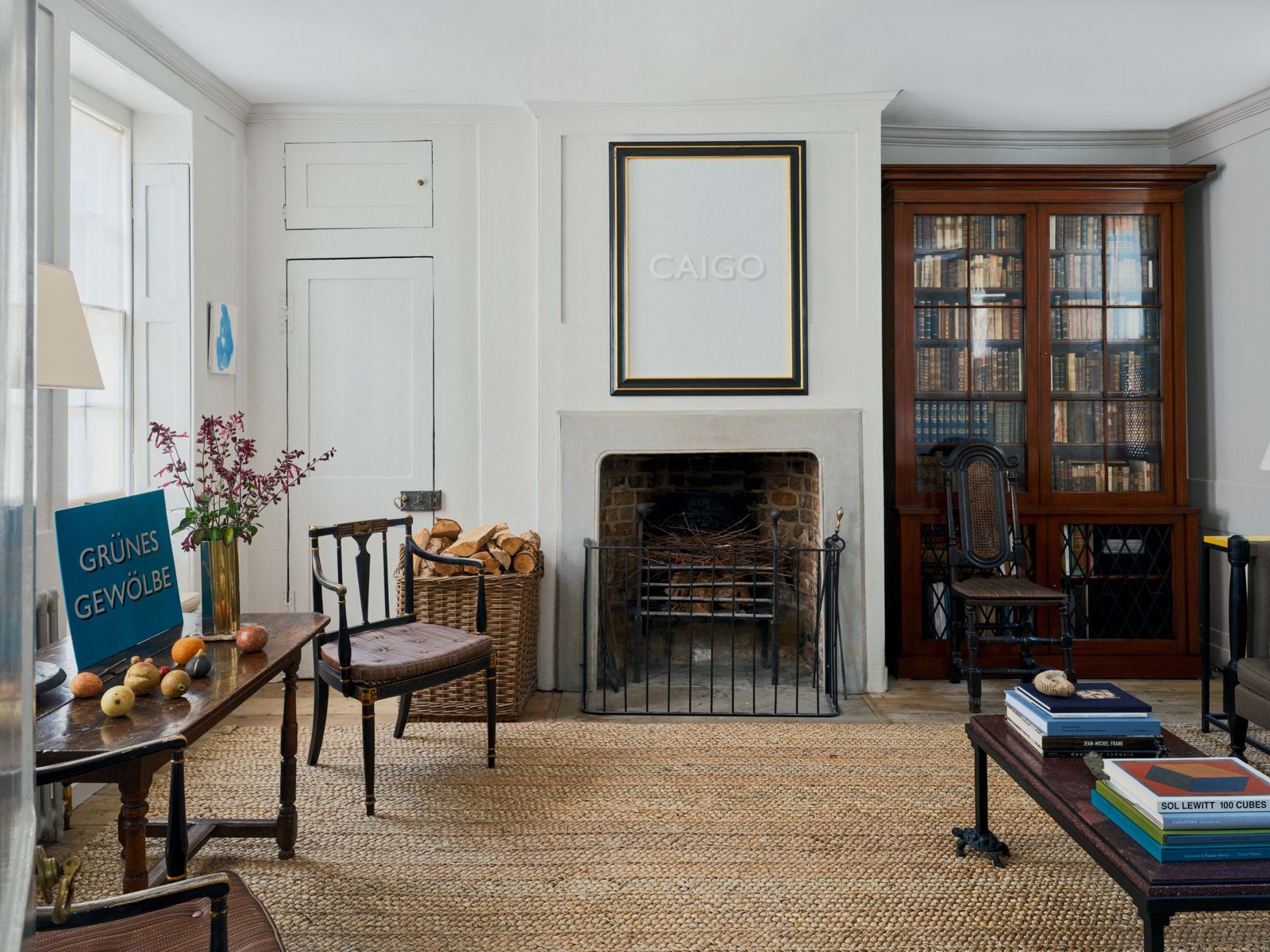 Image may contain Chair Furniture Home Decor Fireplace Indoors Table Desk Rug Interior Design and Architecture