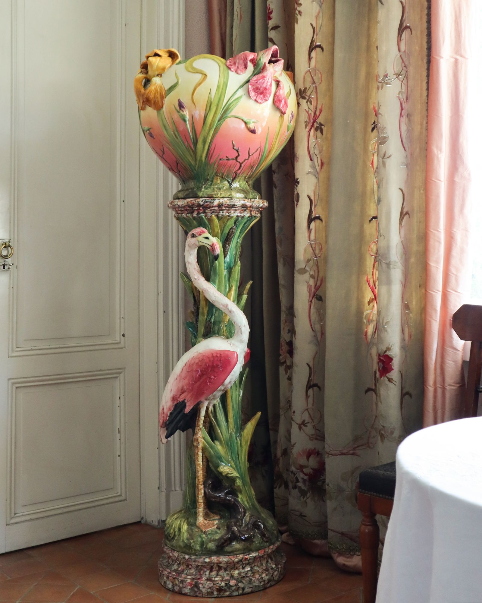 Image may contain Pottery Animal Bird Desk Furniture Table Flower Flower Arrangement Plant Jar and Lamp