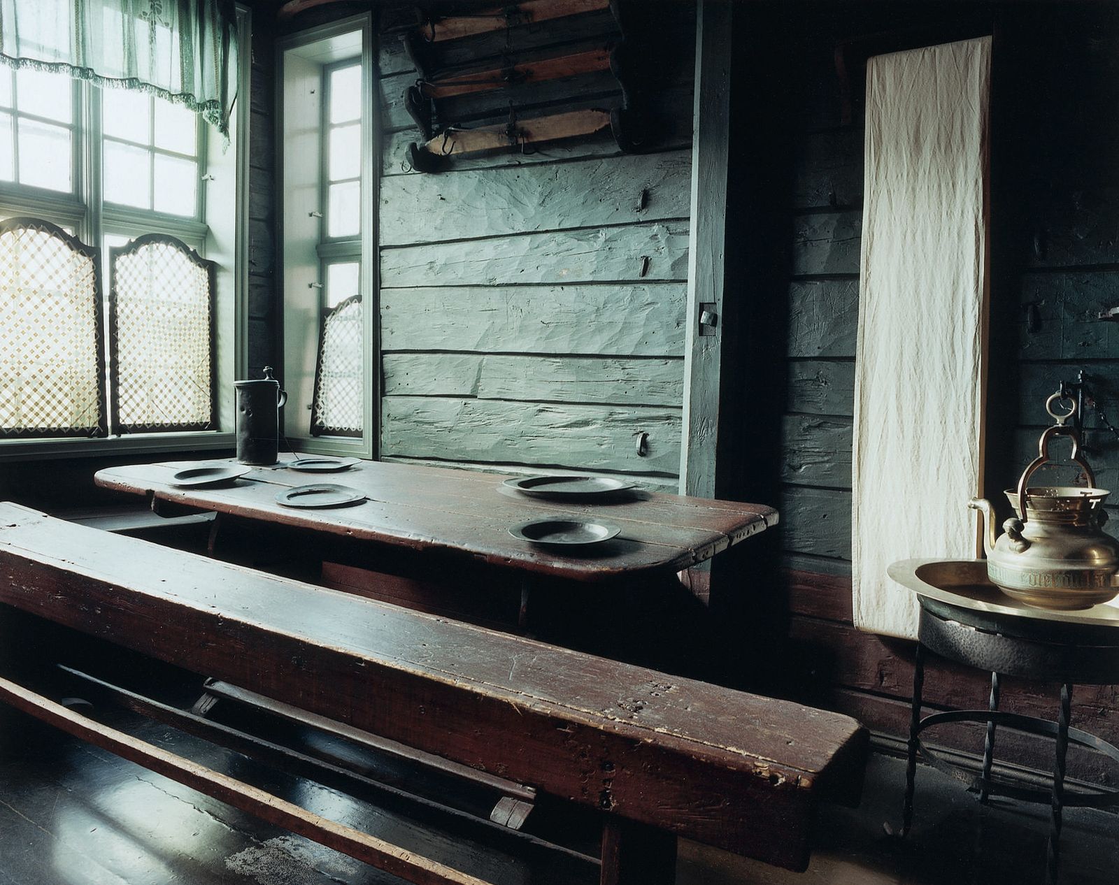 Image may contain Wood Indoors Interior Design Furniture Table Hardwood Tabletop Dining Table and Bench