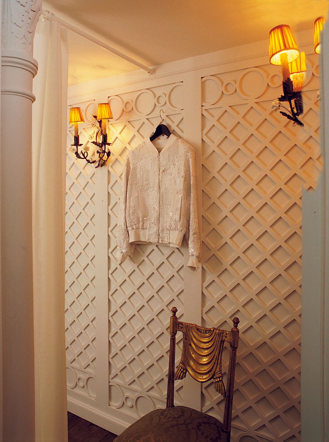 Image may contain Lamp Chair Furniture Dressing Room Indoors Room Interior Design and Chandelier