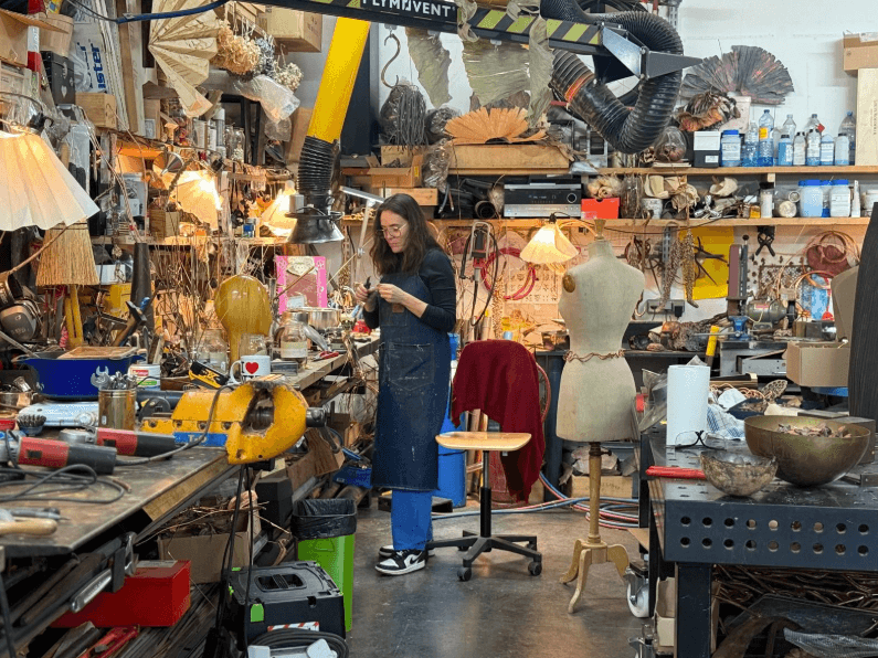 Image may contain Architecture Building Factory Manufacturing Workshop Adult Person Clothing and Coat